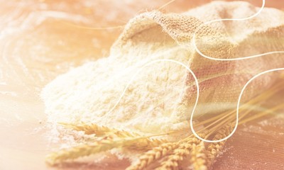 Wheat ears and flour on  background