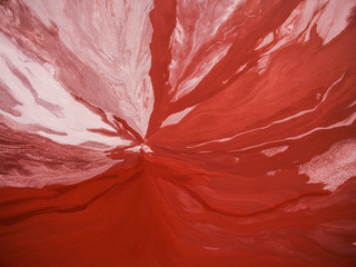 Aerial view of red abstract patterns in Mississippi River