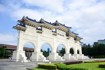 Fototapeta na wymiar the main gate of national Taiwan democracy memorial hall (Chiang Kai-Shek memorial Hall) in sunny day with blue sky and clound background, (The meaning of the Chinese text is 