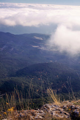 Beautiful amazing stunning mountain landscape, clouds over the mountains, retro toning