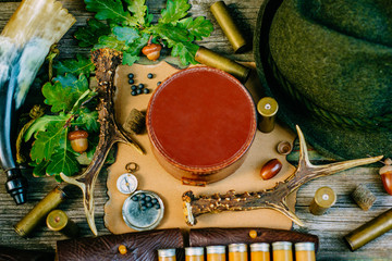 Closeup round leather hunt box for information among hunting or tourist equipment. Top view