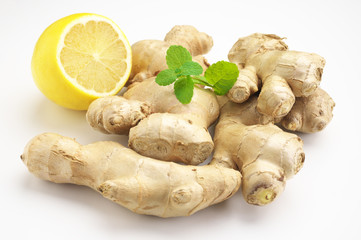 Ginger roots with lemon and mint leaves