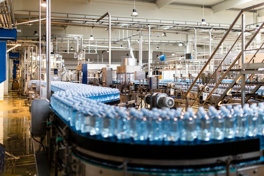 Water bottles on conveyor belt in industry