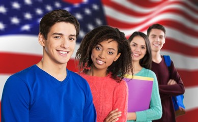 Young Student Girl with backpack and books against american flag