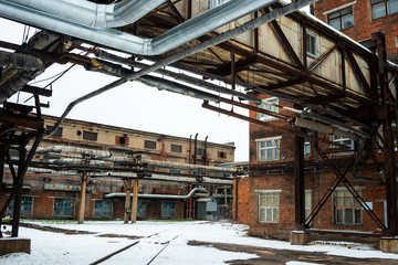 Abandoned manufacture building. Old red brick factory. Wintertime