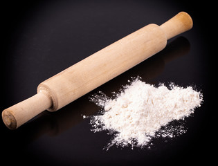 The white flour with a rolling pin