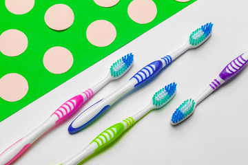 toothbrush on green background, dental care concept