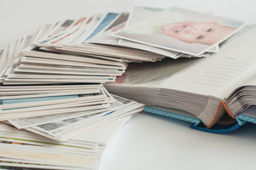 Pile of printed photographs lying in disorder.