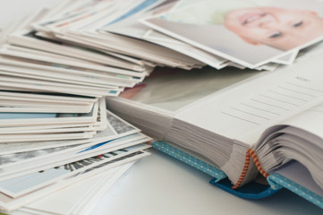 Pile of printed photographs lying in disorder.