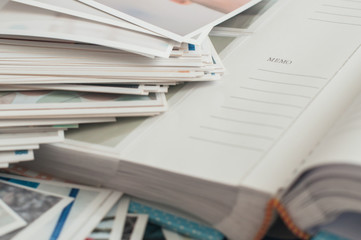 Pile of printed photographs lying in disorder.