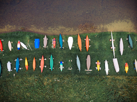 Aerial view of colorful boats moored at harbor by lake