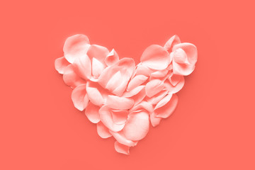 Shape of Heart made of white rose's petals toned in Living Coral color. Color of the year 2019.