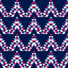 Obraz premium Ethnic boho seamless pattern. The texture of the triangles. Traditional ornament. Tribal pattern. Folk motif. Can be used for wallpaper, textile, invitation card, wrapping, web page background.