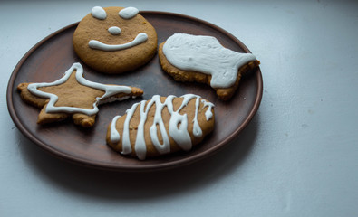 a christmas gingerbread on a plate on white background