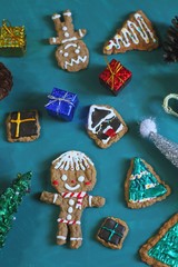 Christmas homemade gingerbread cookies on green background. copy space.