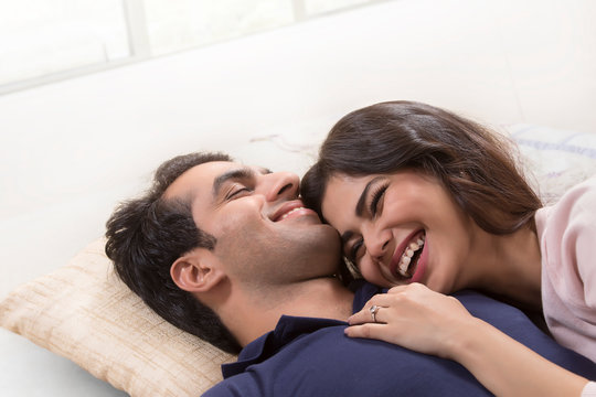 Young couple relaxing on bed	
