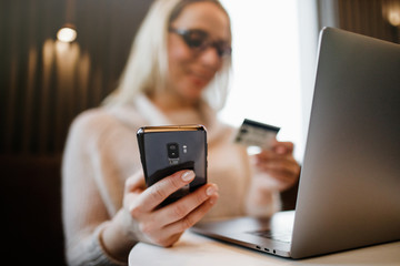 Payment Detail page display. Online payment. Women hands using s