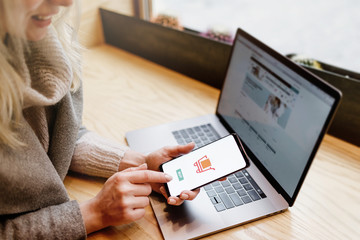 Payment Detail page display. Online payment. Women hands using s