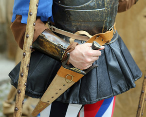 medieval soldier holds a dagger