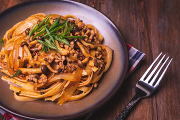 Fettuccine stir fry with Chinese sichuan pepper sauce with mince pork, mushroom and onion, Classic Chinese Italian Food Fusion Dishes