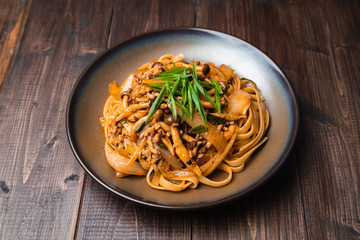 Fettuccine stir fry with Chinese sichuan pepper sauce with mince pork, mushroom and onion, Classic Chinese Italian Food Fusion Dishes
