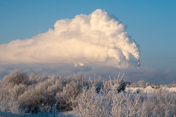 Pipes of thermal power plants emit thick smoke. Thermal power plants in thick fog.
