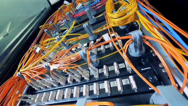 Multicolour cables connected to multiple servers