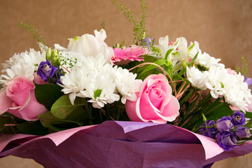 bouquet of flowers pink roses, white chrysanthemums, light striped Alstroemeria, gerberas close-up