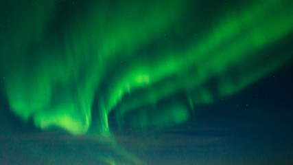 Beautiful stripes of the northern lights, aurora in the night sky.