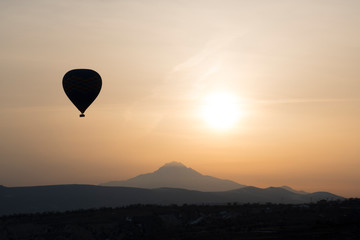 Hot Air Balloon Silhouette with sunny background 
