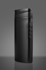 Black Blank Shampoo Bottle Isolated on Gray