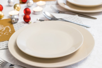 Closeup on empty plate on Christmas Eve table
