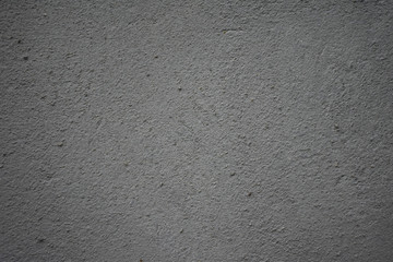 Texture of rough surface gray concrete wall