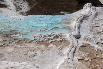Geothermal sources and limestone deposits on the hillsides