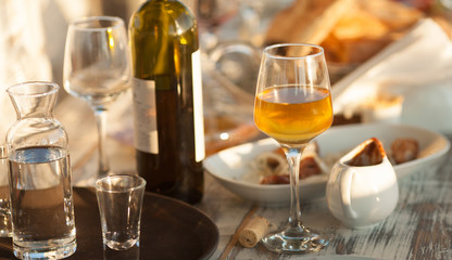 wine glasses and a bottle on a table