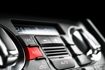 Air conditioning button inside a car. Climate control AC unit in the new car. Modern car interior details. Car detailing.