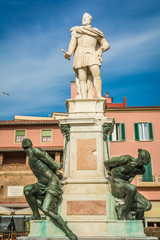 Fototapeta premium the Monument of the Four Moors in Livorno, Italy. It is dedicated to Grand Duke Ferdinando I de Medici of Tuscany.the statue with black African characteristics