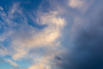 Naklejka na ściany i meble Clouds after rain before sunset as a background