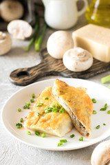 Béchamel baked pancakes stuffed with mushrooms