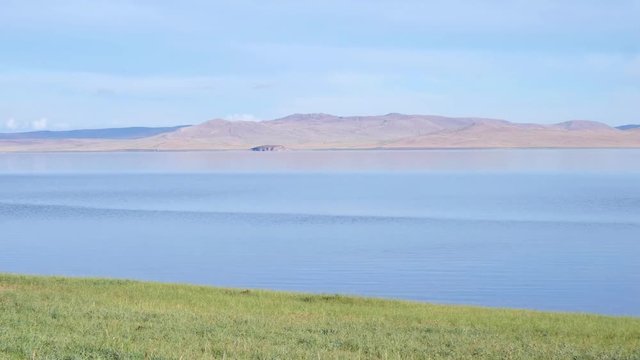 Panoramic video of mongolian lake Telmen Lake surrounded by hills and deserts in north Mongolia