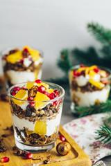 Greek yogurt with granola and orange for healthy breakfast