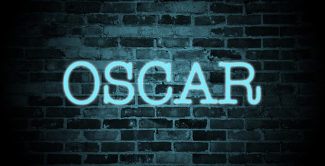 Obraz premium first name Oscar in blue neon on brick wall