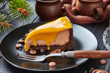 a piece of a chocolate mango cheesecake
