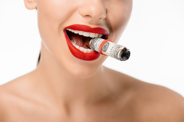 cropped shot of happy naked woman smoking rolled dollar banknotes isolated on white