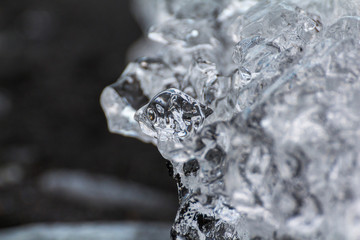 Obraz na płótnie Canvas Crystal clear ice on black lava, diamond beach in iceland