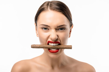 beautiful naked girl holding cigar in teeth and looking at camera isolated on white