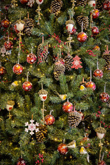 Christmas fir tree with toys, balls and other Christmas decorations.