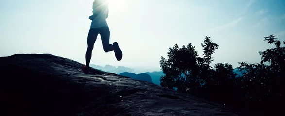 Keuken spatwand met foto young fitness woman trail runner running to mountain top © lzf