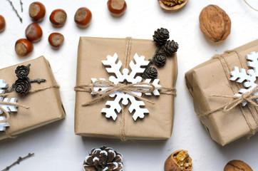 Christmas Gifts, Nuts, Pine Cones on White Background, Nacural Decor Materials, Winter Holidays Concept