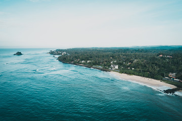 Aerial view of beautiful tropical coastline and fisherman village